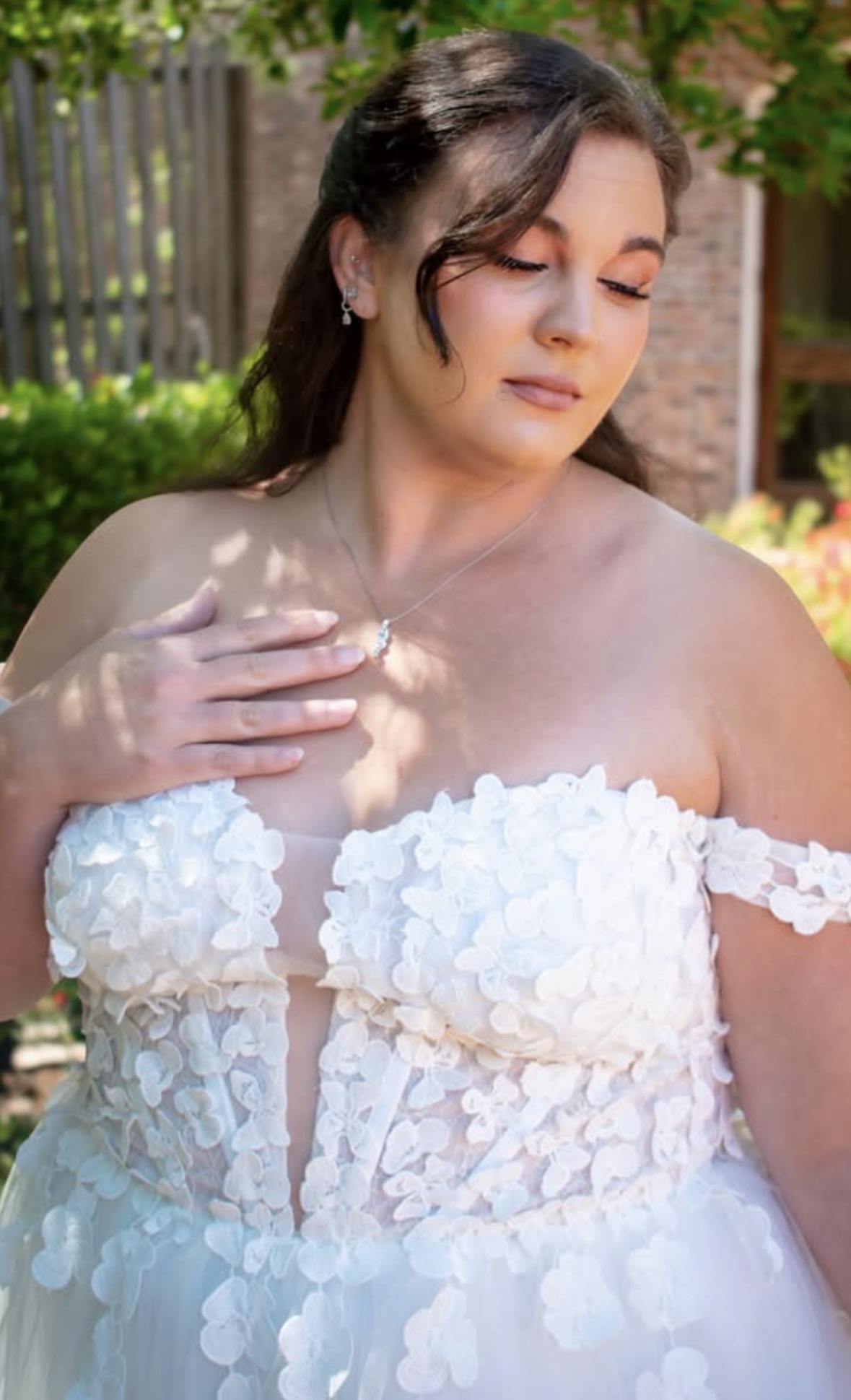Real bride — soft neutral makeup and half-up waves in a 3D floral gown